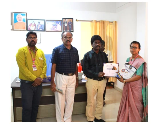 Mrs. K. Isabella Rani receiving the Best Meritorious Award